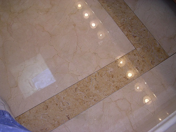 Limestone and Crema Marfil marble bathroom